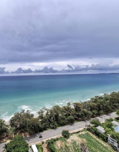 an aerial view of the ocean and a road at Beach front Apartment with Sea View VIP CONDOCHAIN in Rayong