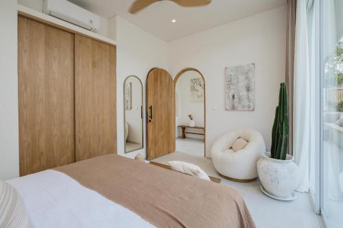 Ένα ή περισσότερα κρεβάτια σε δωμάτιο στο Mazari Villas