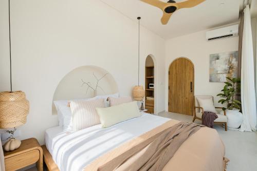 Ένα ή περισσότερα κρεβάτια σε δωμάτιο στο Mazari Villas