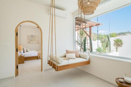 Ένα ή περισσότερα κρεβάτια σε δωμάτιο στο Mazari Villas