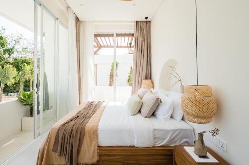 Ένα ή περισσότερα κρεβάτια σε δωμάτιο στο Mazari Villas