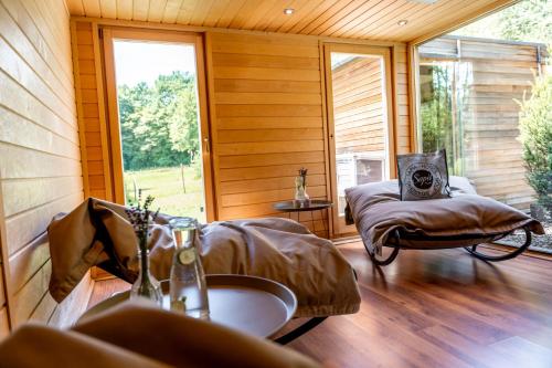 a bathroom with a bed and a sink in a room at Sapia Hotel Rheinsberg in Bad Säckingen