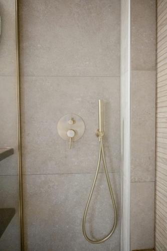 a shower with a glass door with a shower head at Cloud9 Chalet in Arachova