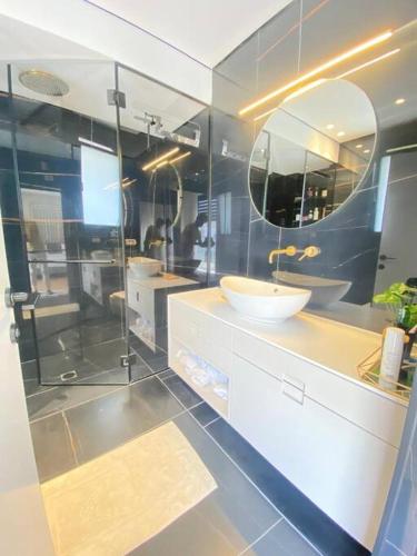 a bathroom with a sink and a mirror at Villa on the beach in Netanya