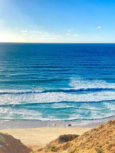 a view of the ocean with a sandy beach at Villa on the beach in Netanya