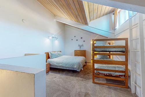 a bedroom with a bunk bed and a bunk bed at Chamonix 20 in Mammoth Lakes
