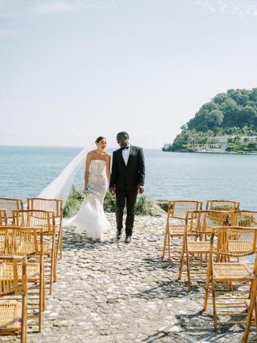 a bride and groom walking down the aisle at their wedding at Round Hill Hotel & Villas in Montego Bay