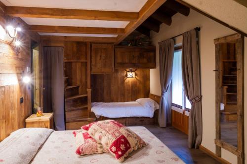 Postel nebo postele na pokoji v ubytování Albergo Boule de Neige