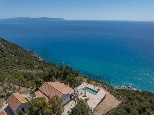 an aerial view of a house and the ocean at Skali Retreat in Atsoupádhes