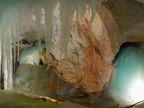 a cave with ice hanging from the ceiling at Waldhaus in Sankt Martin am Tennengebirge