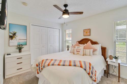 a bedroom with a bed and a ceiling fan at Beautiful House Pool Game Room in Davenport
