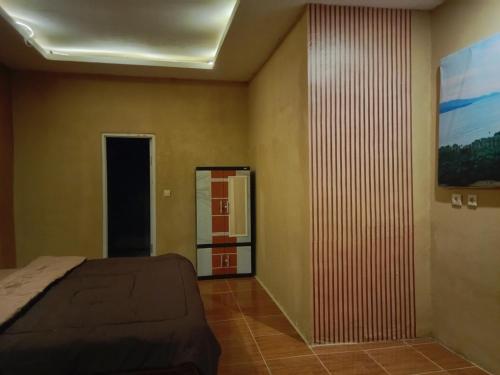 Ένα ή περισσότερα κρεβάτια σε δωμάτιο στο Sagara home