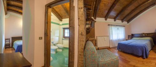 Cama o camas de una habitación en Albergo Boule de Neige
