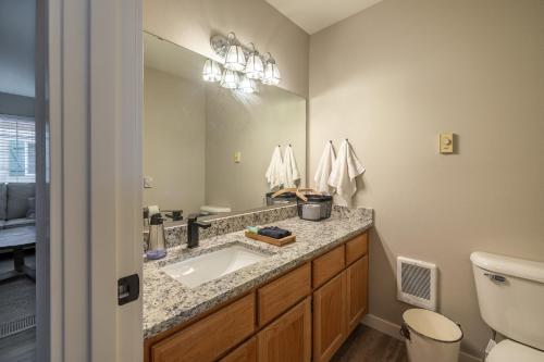 a bathroom with a sink and a mirror at Alpine Greens in Leavenworth