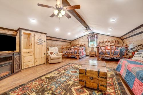 a room with two beds and a flat screen tv at North Georgia Mtn Escape with Hot Tub and Games! in Sautee Nacoochee