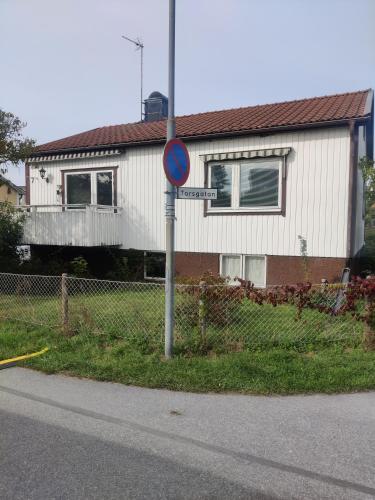 a street sign in front of a house at Cosy and practical Norrtälje in Norrtälje