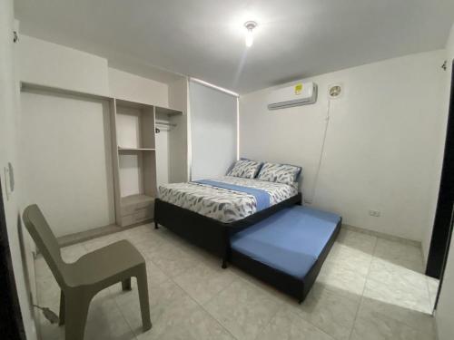 En eller flere senge i et værelse på Cielo y Olas - Apto de 3 Alcobas en El Rodadero