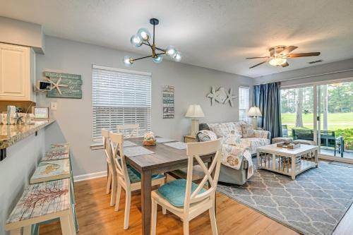 a kitchen and living room with a table and chairs at 1st-Floor Condo with Pool on Intracoastal Waterway! in Myrtle Beach