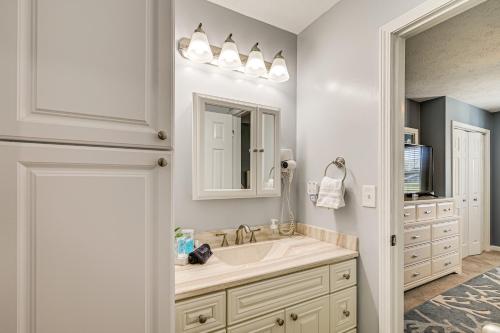a bathroom with a sink and a mirror at 1st-Floor Condo with Pool on Intracoastal Waterway! in Myrtle Beach
