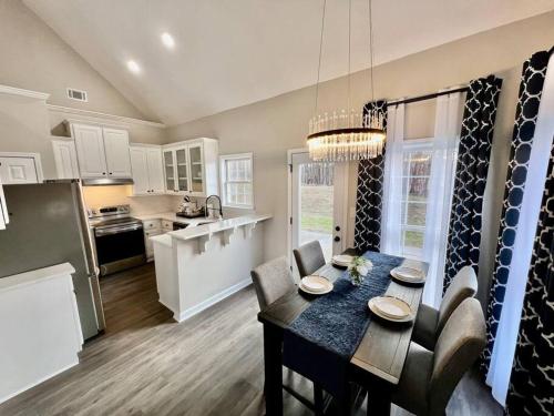 a kitchen and dining room with a table and chairs at Lake Lanier House 1 in Gainesville