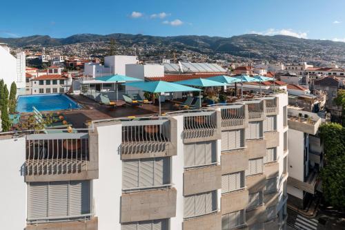 an aerial view of a building with a pool at Hotel Madeira in Funchal