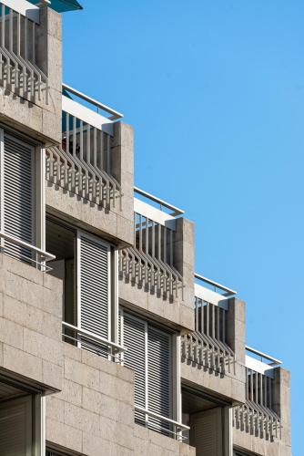 a building with balconies on the side of it at Hotel Madeira in Funchal