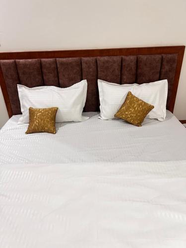 Postel nebo postele na pokoji v ubytování SAHAR HOMEstay 02