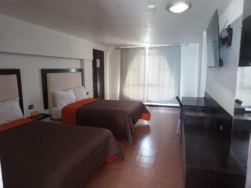 Кровать или кровати в номере Hotel Essen's