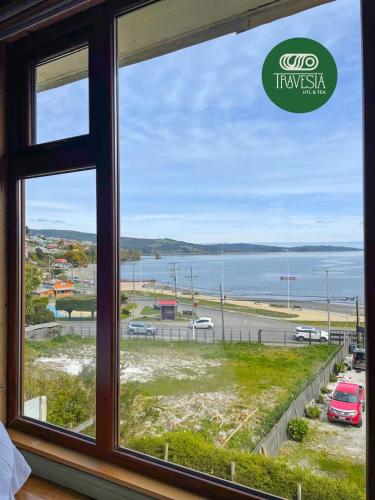 a window with a view of the ocean at Travesia Hotel & Tea in Ancud