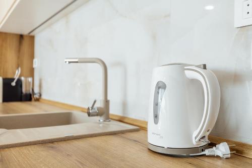 a mixer sitting on a kitchen counter next to a sink at Savina Bliss Residences in Herceg-Novi