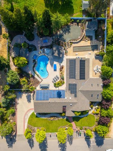 an overhead view of a resort with a swimming pool at Casteel - 4,500 sq-ft retreat with a pool and hot tub in the middle of wine country! in Templeton