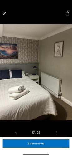a picture of a bedroom with a white bed at Kings head in Chacewater