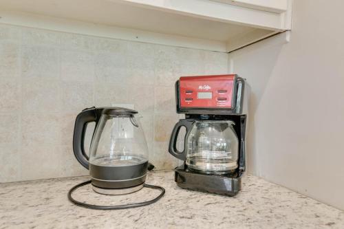 a coffee maker and a blender sitting on a counter at Private Pool Spacious 5BR Family-Friendly Home in Conyers