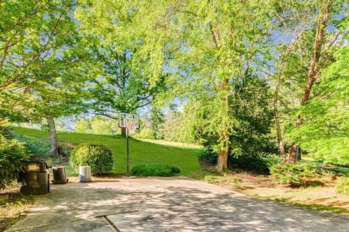 a driveway with a basketball hoop in a park at Private Pool Spacious 5BR Family-Friendly Home in Conyers