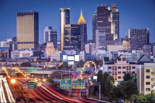 a view of a city at night with traffic at The Conyers Oasis - 10 mins to horse park in Conyers