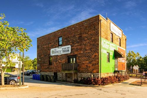 a brick building with a sign on the side of it at The Conyers Oasis - 10 mins to horse park in Conyers