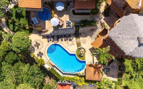 an overhead view of a swimming pool in a resort at Casa Ceiba Huatulco - Adults Only in Santa Cruz Huatulco
