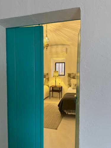 a room with a bedroom with a bed and a mirror at Casa Sítio do Vale, Alandroal in Alandroal