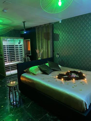 a bedroom with a large bed with lights on it at Love Instant in Chalon-sur-Saône