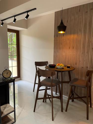 a dining room with a table and chairs in a room at VRhome Hilly Side in Tsaghkadzor