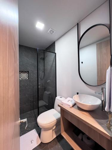 a bathroom with a toilet and a sink and a shower at Parallelo loft Salento P5 in Salento