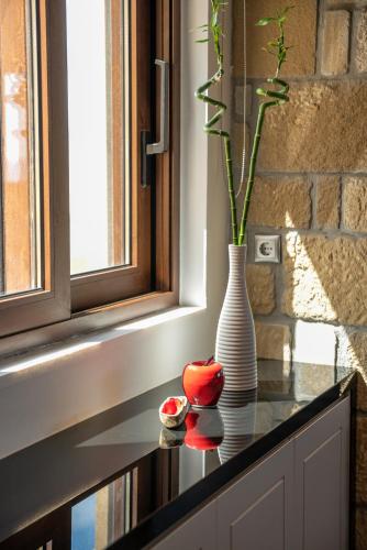 a vase sitting on top of a counter with a vase at VenMar luxury house in Platanias