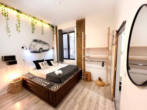 a bedroom with a bed with a car on the wall at ECO Hostel in Granada