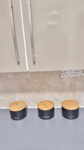 two stools sitting on the floor in a kitchen at Cozy 4-Bed House in Accrington in Accrington