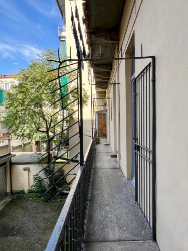 an empty hallway of a building with a gate at Casa Matisse in Turin