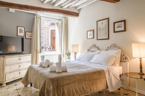Кровать или кровати в номере Il Battistero Siena Residenza d'Epoca