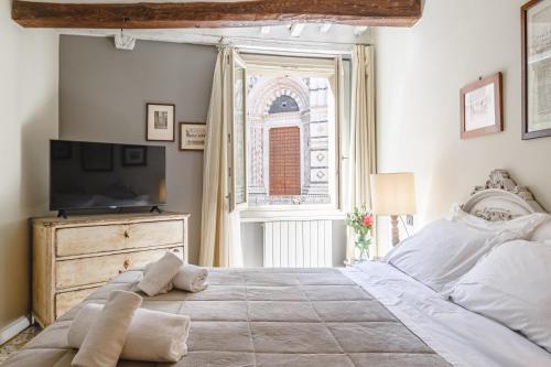 Кровать или кровати в номере Il Battistero Siena Residenza d'Epoca