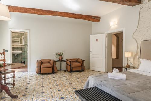Кровать или кровати в номере Il Battistero Siena Residenza d'Epoca