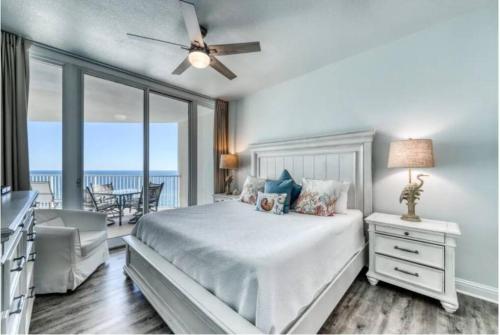 a bedroom with a bed and a view of the ocean at Lighthouse 1115 Condo on the beach 3BR 3BA in Gulf Shores