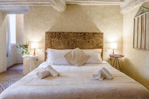 Кровать или кровати в номере Il Battistero Siena Residenza d'Epoca